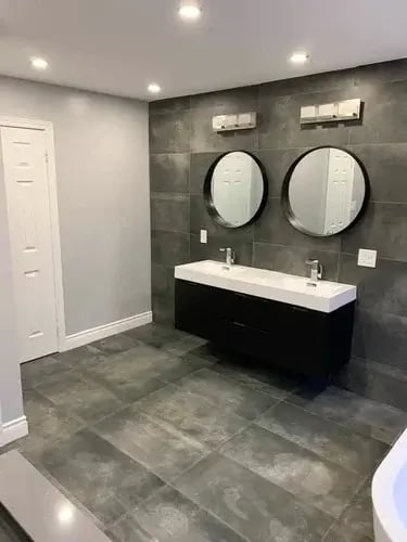 dark grey bathroom and double vanity installation from floor heaven located in Hamilton and Stoney Creek Ontario